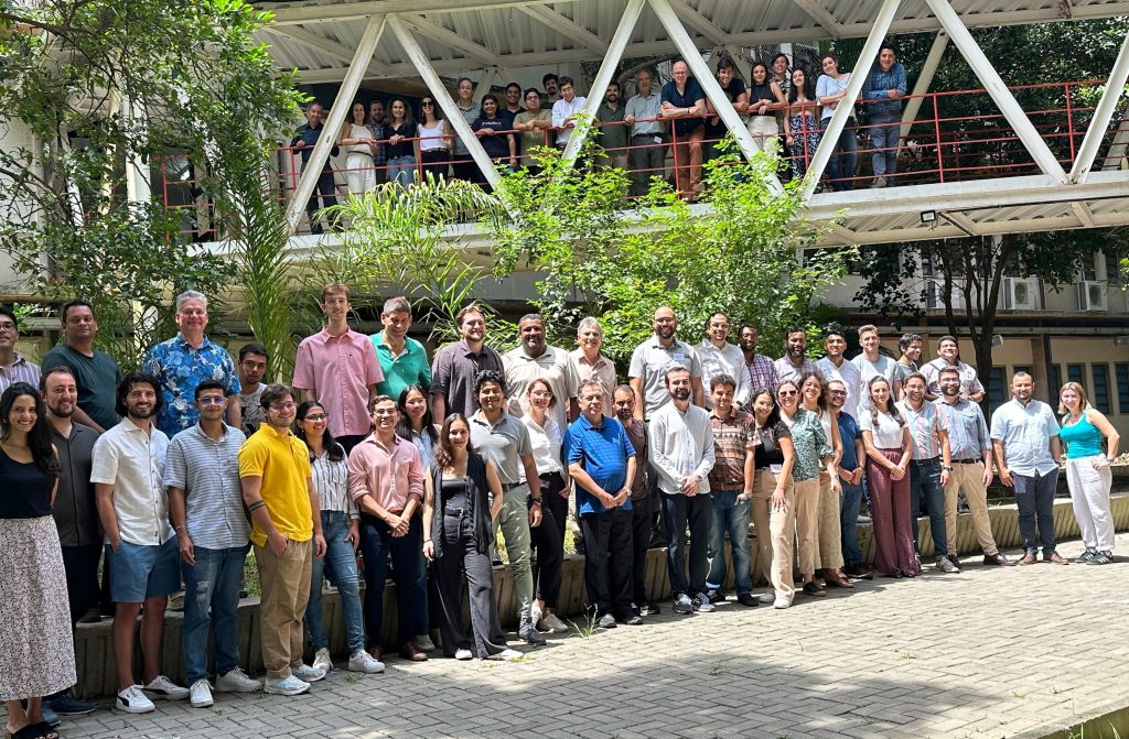 A large group photo of participants at EMP-LAC, taken in Brazil, January 2024