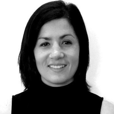 A black and white photograph of a women with long black hair